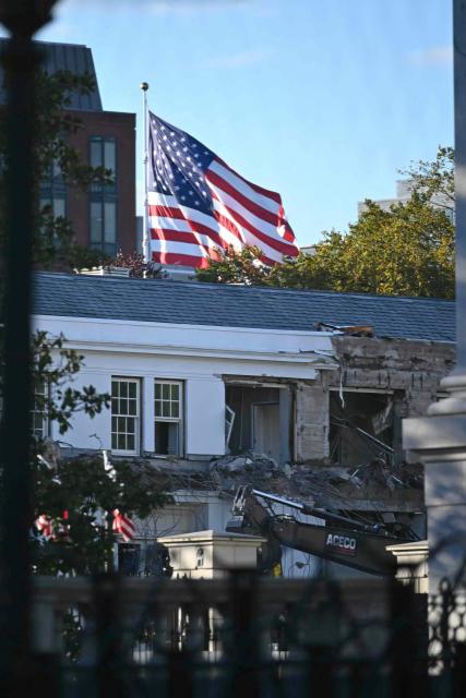 Heavy machinery tears down a section of the East Wing of the White House as construction begins on President Donald Trumps planned ballroom, in Washington, DC, on October 20, 2025. US President Donald Trump held a glitzy dinner October 15, 2025 to thank billionaires and top companies for donating to the new $250 million ballroom he is building at the White House. The guests included representatives from tech firms like Amazon, Apple, Meta, Google, Microsoft and Palantir and defense giant Lockheed Martin, according to US media citing a White House guest list. (Photo by Pedro UGARTE / AFP)