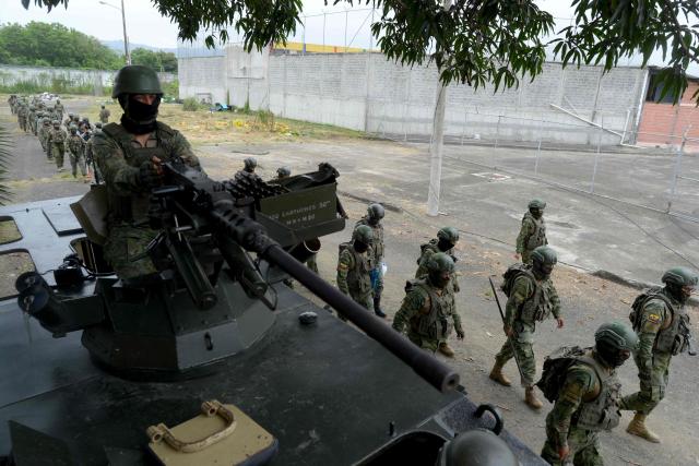 (FILES) Military personnel take part in a raid at the Manabi N4 Detention Center, also known as El Rodeo Prison, in Portoviejo, Manabi province, Ecuador, on June 5, 2024. Since 2023, when President Daniel Noboa took office, Amnesty International has documented 43 cases of enforced disappearances carried out by state agents in Ecuador. (Photo by Gerardo MENOSCAL / AFP)