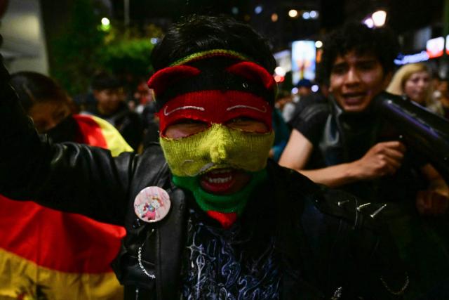 A demonstrator shouts "fraud" during a protest against president-elect Rodrigo Paz following the results of the run-off presidential election in La Paz on October 20, 2025. Paz, a 58-year-old economist, won Sunday's election with 54.5% of the counted votes, ahead of right-wing former president Jorge Quiroga, who received 45.4%, according to the official tally. He is set to take office on November 8. (Photo by MARTIN BERNETTI / AFP)
