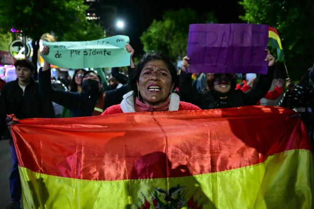 Demonstrators protest against president-elect Rodrigo Paz following the results of the run-off presidential election in La Paz on October 20, 2025. Paz, a 58-year-old economist, won Sunday's election with 54.5% of the counted votes, ahead of right-wing former president Jorge Quiroga, who received 45.4%, according to the official tally. He is set to take office on November 8. (Photo by MARTIN BERNETTI / AFP)