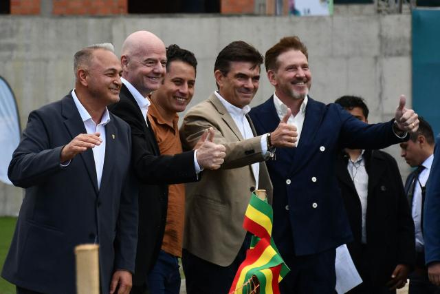 FIFA President Gianni Infantino (2nd L) poses for a picture with Bolivia's president-elect Rodrigo Paz (2nd R), Bolivian Football Federation President Fernando Costa (L), Bolivia's vice president-elect Edman Lara (C), and CONMEBOL President Alejandro Dominguez during his visit to the country to inaugurate the first phase of the Bolivian national team's High-Performance Center, known as "La Casa de la Verde," in La Paz on October 20, 2025. (Photo by Roberto ARANDA / AFP)