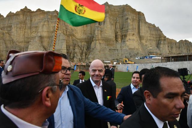 FIFA President Gianni Infantino (C) attends the inauguration of the first phase of the Bolivian national team's High-Performance Center, known as "La Casa de la Verde," in La Paz on October 20, 2025. (Photo by Roberto ARANDA / AFP)