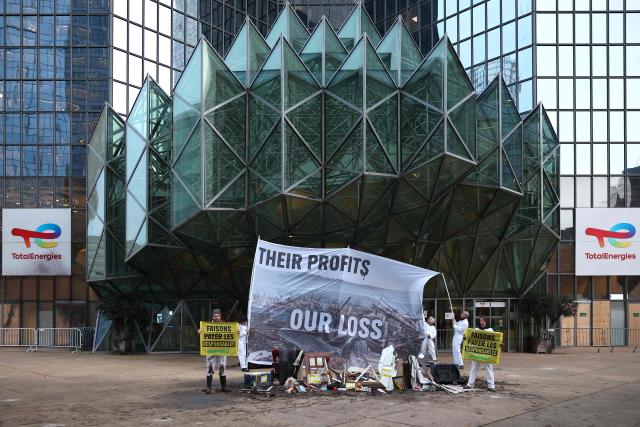 (FILES) Greenpeace activists poses during a protest against polluters in front of TotalEnergies' headquarters at La Defense business district, west of Paris, on November 18, 2024. The Paris court will deliver a closely watched ruling on October 23, 2025 in a groundbreaking "greenwashing" case in France involving a multinational energy company.
The judicial court, approached in March 2022 by NGOs Greenpeace France, Friends of the Earth France, and Notre Affaire à Tous, must determine whether TotalEnergies disseminated "misleading advertisements" by suggesting it could "help preserve the planet" while continuing to drill for oil and gas. Closely followed by economic circles and climate advocates, the decision could set a new precedent in the emerging European case law on corporate environmental communication. (Photo by Gregoire CAMPIONE / AFP)