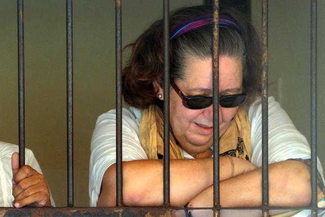 (FILES) British national Lindsay Sandiford reacts in her holding cell after she was sentenced to death for trafficking drugs worth an estimated 2.14 million USD, following a hearing at a court in Denpasar, Indonesia's Bali island, on January 22, 2013. Indonesia will sign an agreement on October 21, 2025 to repatriate two British nationals, including Sandiford - a grandmother, languishing on death row for drug-related crimes, an Indonesian government source told AFP. (Photo by SONNY TUMBELAKA / AFP)