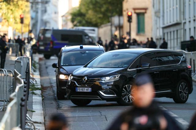 France's former president Nicolas Sarkozy arrives aboard a vehicle at La Sante Prison for incarceration on a five-year prison sentence after being convicted of criminal conspiracy over a plan for late Libyan dictator Moamer Kadhafi to fund his 2007 electoral campaign, in Paris, on October 21, 2025. Nicolas Sarkozy, who has faced a flurry of legal woes since losing re-election in 2012, is to be jailed on October 21, 2025, over a scheme to acquire Libyan funding for his successful 2007 presidential run, becoming the first former head of a European Union country to serve time behind bars. The former French right-wing leader has appealed the verdict and denounced an "injustice". (Photo by Alain JOCARD / AFP)