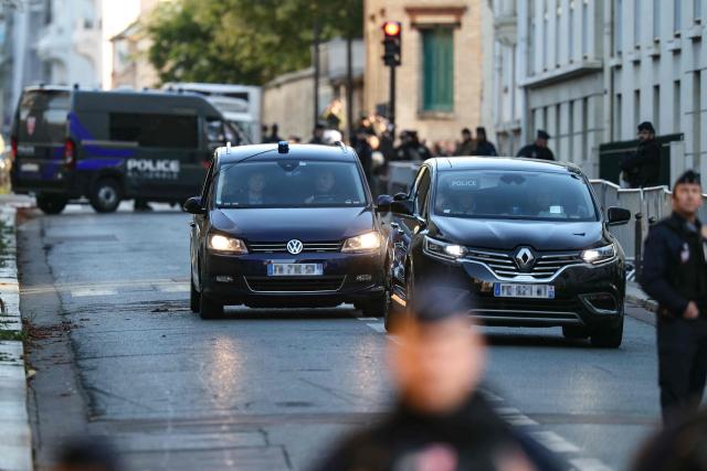 France's former president Nicolas Sarkozy arrives aboard a vehicle at La Sante Prison for incarceration on a five-year prison sentence after being convicted of criminal conspiracy over a plan for late Libyan dictator Moamer Kadhafi to fund his 2007 electoral campaign, in Paris, on October 21, 2025. Nicolas Sarkozy, who has faced a flurry of legal woes since losing re-election in 2012, is to be jailed on October 21, 2025, over a scheme to acquire Libyan funding for his successful 2007 presidential run, becoming the first former head of a European Union country to serve time behind bars. The former French right-wing leader has appealed the verdict and denounced an "injustice". (Photo by Alain JOCARD / AFP)