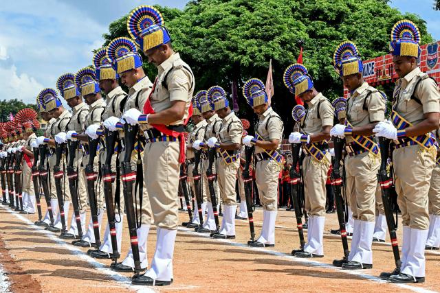 Police personnel pay tribute to slain police officers during an event held to mark 'Police Commemoration Day' in Hyderabad on October 21, 2025. (Photo by Noah SEELAM / AFP)