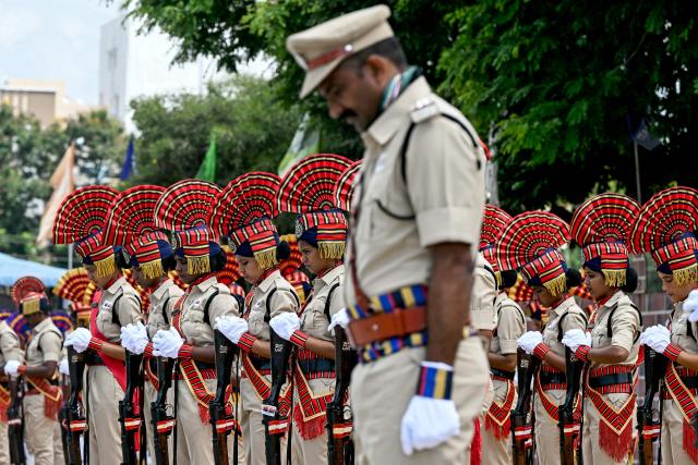 Police personnel pay tribute to slain police officers during an event held to mark 'Police Commemoration Day' in Hyderabad on October 21, 2025. (Photo by Noah SEELAM / AFP)
