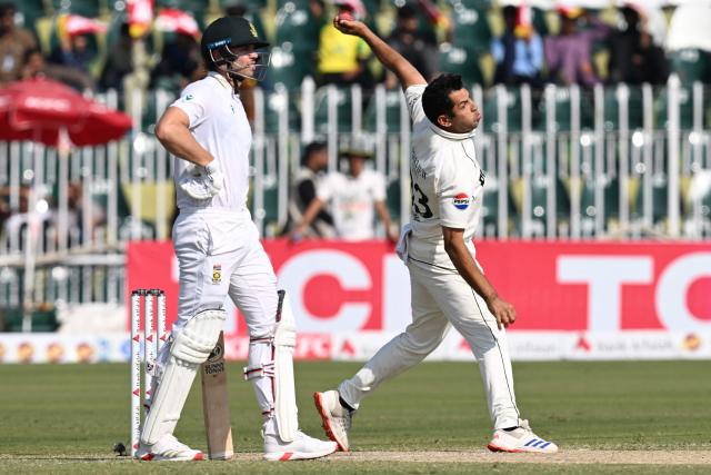 Pakistan's Asif Afridi (R) bowls as South Africa's Tristan Stubbs watches during the second day of the second Test cricket match between Pakistan and South Africa at the Rawalpindi Cricket Stadium in Rawalpindi on October 21, 2025. (Photo by Aamir QURESHI / AFP)