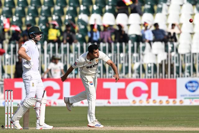 Pakistan's Asif Afridi (R) bowls as South Africa's Tristan Stubbs watches during the second day of the second Test cricket match between Pakistan and South Africa at the Rawalpindi Cricket Stadium in Rawalpindi on October 21, 2025. (Photo by Aamir QURESHI / AFP)