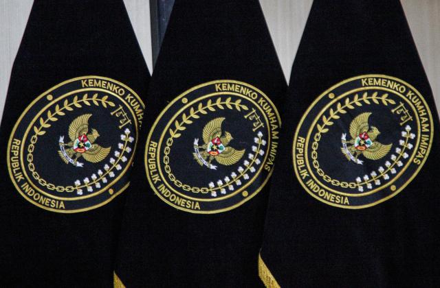 Frags with emblem of Indonesia's Coordinating Ministry for Law, Human Rights, Immigration and Corrections are seen at the ministry's office in Jakarta, on October 21, 2025. Indonesia will repatriate Lindsay Sandiford, a 68-year-old British woman sentenced to death in 2013 for smuggling cocaine to Bali, and Shahab Shahabadi, 35, imprisoned in the same case, under the bilateral repatriation agreement. (Photo by Aditya IRAWAN / AFP)