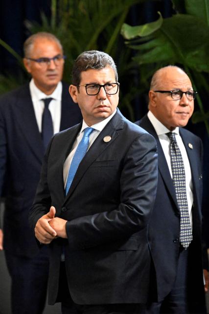 Egypt's intelligence head Hassan Rashad (C) is pictured on the sidelines of a summit meeting on Gaza in the Red Sea resort of Sharm el-Sheikh on October 13, 2025. Rashad met Israel's Prime Minister Benjamin Netanyahu in Jerusalem on October 21 for talks aimed at reinforcing a fragile US-backed ceasefire in Gaza. Rashad's trip to Jerusalem comes more than a week into a fragile truce between Israel and Hamas, under a deal brokered in the Egyptian Red Sea resort town of Sharm El-Sheikh. (Photo by Khaled DESOUKI / AFP)