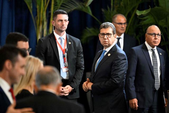 Egypt's intelligence head Hassan Rashad (C) is pictured on the sidelines of a summit meeting on Gaza in the Red Sea resort of Sharm el-Sheikh on October 13, 2025. Rashad met Israel's Prime Minister Benjamin Netanyahu in Jerusalem on October 21 for talks aimed at reinforcing a fragile US-backed ceasefire in Gaza. Rashad's trip to Jerusalem comes more than a week into a fragile truce between Israel and Hamas, under a deal brokered in the Egyptian Red Sea resort town of Sharm El-Sheikh. (Photo by Khaled DESOUKI / AFP)