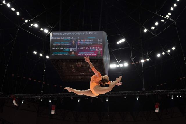 Brazil's Flavia Saraiva competes on the balance beam during the women's qualifying session at the 53rd FIG Artistic Gymnastics World Championships in Jakarta on October 21, 2025. (Photo by Yasuyoshi CHIBA / AFP)