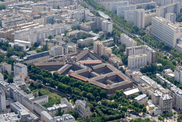 (FILES) An aerial picture taken aboard an helicopter on July 20, 2010 shows a view of the Maison d'arret de la Sante (the Sante prison) located in the 14th district of Paris. France's ex-president Nicolas Sarkozy became the first former head of an EU state to be jailed on October 21, 2025, proclaiming his innocence as he entered the Paris Sante prison. France's right-wing leader from 2007 to 2012 was found guilty last month of seeking to acquire funding from Moamer Kadhafi's Libya for the campaign that saw him elected. (Photo by BORIS HORVAT / AFP)
