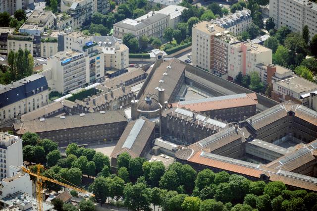 (FILES) An aerial picture taken aboard an helicopter on July 20, 2010 shows a view of the Maison d'arret de la Sante (the Sante prison) located in the 14th district of Paris. France's ex-president Nicolas Sarkozy became the first former head of an EU state to be jailed on October 21, 2025, proclaiming his innocence as he entered the Paris Sante prison. France's right-wing leader from 2007 to 2012 was found guilty last month of seeking to acquire funding from Moamer Kadhafi's Libya for the campaign that saw him elected. (Photo by BORIS HORVAT / AFP)