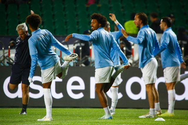Pafos FC's players warm up prior to the UEFA Champions League football match between Kairat Almaty and Pafos at the Almaty Ortalyk stadion in Almaty on October 21, 2025. (Photo by Ruslan PRYANIKOV / AFP)