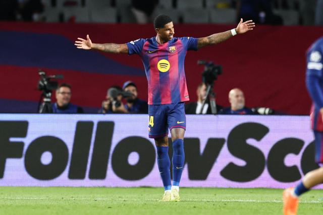 Barcelona's English forward #14 Marcus Rashford celebrates after scoring their sixth goal during the UEFA Champions League league phase match-day 3 football match between FC Barcelona and Olympiakos FC at Estadi Olimpic Lluis Companys in Barcelona on October 21, 2025. (Photo by Josep LAGO / AFP)