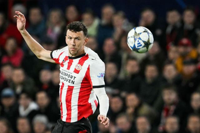 PSV Eindhoven's Dutch forward #05 Ivan Perisic eyes the ball as he jumps for it during the UEFA Champions League, league phase football match between PSV Eindhoven and Napoli at the Philips Stadium, in Eindhoven, on October 21, 2025. (Photo by NICOLAS TUCAT / AFP)