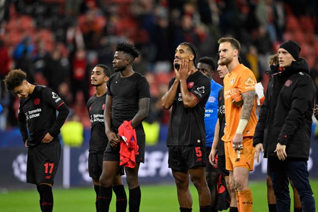Leverkusen"s players react after the UEFA Champions League football match between Bayer 04 Leverkusen and Paris Saint-Germain (PSG) at the BayArena stadium in Leverkusen, western Germany on October 21, 2025. (Photo by INA FASSBENDER / AFP)