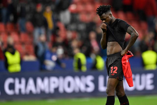 Bayer Leverkusen's Burkinabe defender #12 Edmond Tapsoba reacts after the UEFA Champions League football match between Bayer 04 Leverkusen and Paris Saint-Germain (PSG) at the BayArena stadium in Leverkusen, western Germany on October 21, 2025. (Photo by INA FASSBENDER / AFP)