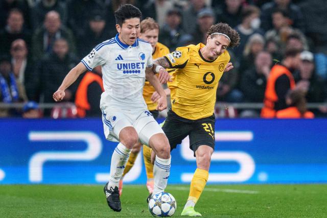 FC Copenhagen's Japanese defender #20 Junnosuke Suzuki and Dortmund's Portuguese forward #21 Fabio Silva vie for the ball during the UEFA Champions League football match between FC Copenhagen and BVB Borussia Dortmund in Copenhagen on October 21, 2025. (Photo by Liselotte Sabroe / Ritzau Scanpix / AFP) / Denmark OUT