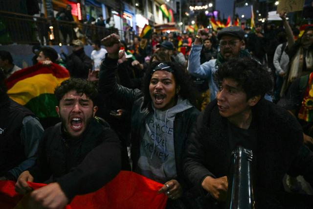 Supporters of Bolivia's former president and presidential candidate for the Freedom and Democracy (Libre) alliance, Jorge "Tuto" Quiroga, take part in a protest demanding a vote audit by the Supreme Electoral Tribunal (TSE) following the presidential election, in La Paz on October 21, 2025. Rodrigo Paz, a 58-year-old economist, won the second round of voting on October 19 with 54.5 percent of the votes against former right-wing president Jorge Quiroga. (Photo by AIZAR RALDES / AFP)