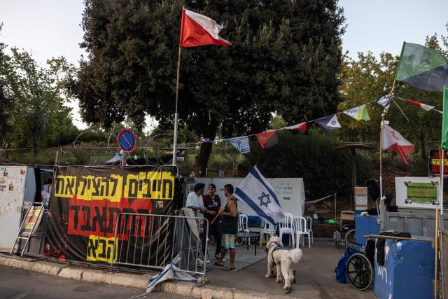 Former Israeli soldiers suffering from PTSD Post-Traumatic Stress Disorder, a psychological injury of war, chat during a sit-in demonstration outside the Knesset (Israeli Parliament) in Jerusalem on September 15, 2025. An army report from July 2025 noted 9,000 requests for recognition of "psychological suffering" submitted to military health services since the latest Gaza war began. The 2014 Gaza conflict, which was also against Hamas but lasted less than two months, saw the Israeli military recognise 159 soldiers suffering from psychological trauma. (Photo by Menahem Kahana / AFP)