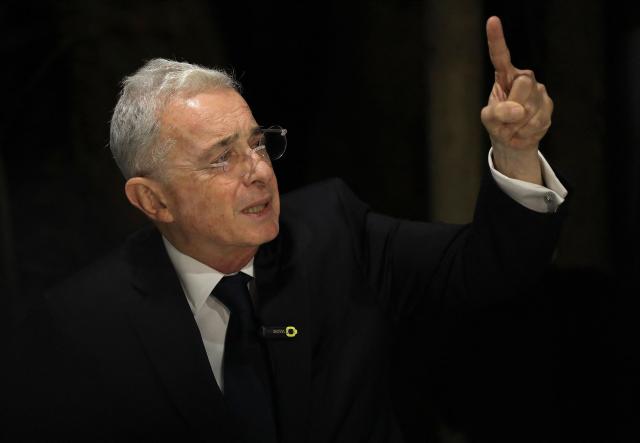 Former Colombian President Alvaro Uribe speaks during a press conference in Rionegro, Antioquia department, Colombia on October 21, 2025. A Colombian court on Tuesday overturned the witness tampering conviction of influential ex-president Alvaro Uribe, who had been sentenced to 12 years' house arrest in a decision condemned by the US. (Photo by JAIME SALDARRIAGA / AFP)