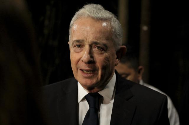 Former Colombian President Alvaro Uribe leaves after a press conference in Rionegro, Antioquia department, Colombia on October 21, 2025. A Colombian court on Tuesday overturned the witness tampering conviction of influential ex-president Alvaro Uribe, who had been sentenced to 12 years' house arrest in a decision condemned by the US. (Photo by JAIME SALDARRIAGA / AFP)