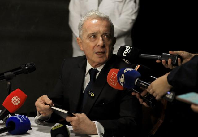 Former Colombian President Alvaro Uribe speaks during a press conference in Rionegro, Antioquia department, Colombia on October 21, 2025. A Colombian court on Tuesday overturned the witness tampering conviction of influential ex-president Alvaro Uribe, who had been sentenced to 12 years' house arrest in a decision condemned by the US. (Photo by JAIME SALDARRIAGA / AFP)