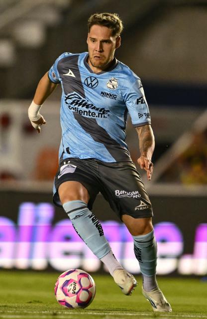 Puebla's Uruguayan forward #11 Emiliano Gomez controls the ball during the Liga MX Apertura football match between America and Puebla at the Banorte Stadium in Mexico City on October 21, 2025. (Photo by Yuri CORTEZ / AFP)