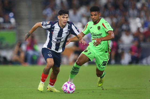Monterrey's defender #03 Gerardo Arteaga and Juarez's Colombian midfielder #07 Diego Valoyes fight for the ball during the Liga MX Apertura football match between Monterrey and Juarez at the BBVA Stadium in Monterrey, Mexico, on October 21, 2025. (Photo by Julio Cesar AGUILAR / AFP)