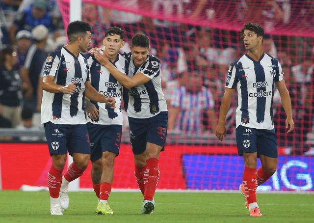 Monterrey's defender #03 Gerardo Arteaga celebrates with teammates after scoring the opening goal during the Liga MX Apertura football match between Monterrey and Juarez at the BBVA Stadium in Monterrey, Mexico, on October 21, 2025. (Photo by Julio Cesar AGUILAR / AFP)