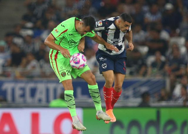 Juarez's defender #26 Jose Garcia AND Monterrey's Argentine forward #07 German Berterame fight for the ball during the Liga MX Apertura football match between Monterrey and Juarez at the BBVA Stadium in Monterrey, Mexico, on October 21, 2025. (Photo by Julio Cesar AGUILAR / AFP)