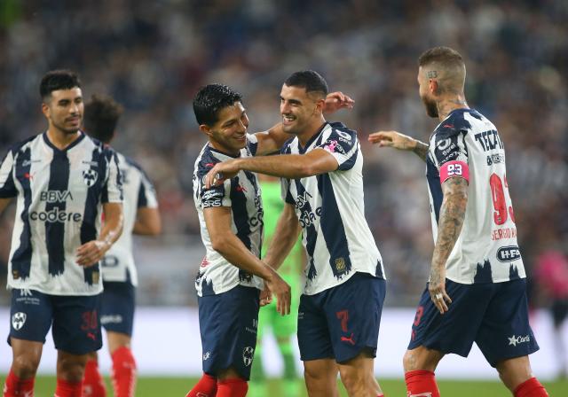 Monterrey's Argentine forward #07 German Berterame celebrates with teammates after scoring his team's third goal during the Liga MX Apertura football match between Monterrey and Juarez at the BBVA Stadium in Monterrey, Mexico, on October 21, 2025. (Photo by Julio Cesar AGUILAR / AFP)
