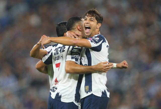 Monterrey's Argentine forward #07 German Berterame celebrates after scoring his team's third goal with teammate Spanish midfielder #08 Oliver Torres during the Liga MX Apertura football match between Monterrey and Juarez at the BBVA Stadium in Monterrey, Mexico, on October 21, 2025. (Photo by Julio Cesar AGUILAR / AFP)