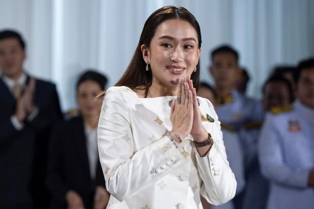(FILES) Thai Prime Minister Paetongtarn Shinawatra, known by her nickname "Ung Ing" and daughter of former prime minister Thaksin Shinawatra, gestures during a press conference after the royal endorsement ceremony appointing her as the new Prime Minister of Thailand, in Bangkok on August 18, 2024. Thailand's recently removed prime minister Paetongtarn Shinawatra resigned on October 22, 2025 as leader of the party founded by her father, ex-premier Thaksin, signaling the potential end of the family's decades-long political dynasty. (Photo by Chanakarn LAOSARAKHAM / AFP)