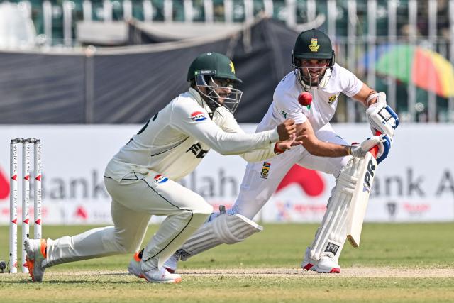 Pakistan's Imam-ul-Haq (L) drops a catch of South Africa's Keshav Maharaj during the third day of the second Test cricket match between Pakistan and South Africa at the Rawalpindi Cricket Stadium in Rawalpindi on October 22, 2025. (Photo by Aamir QURESHI / AFP)