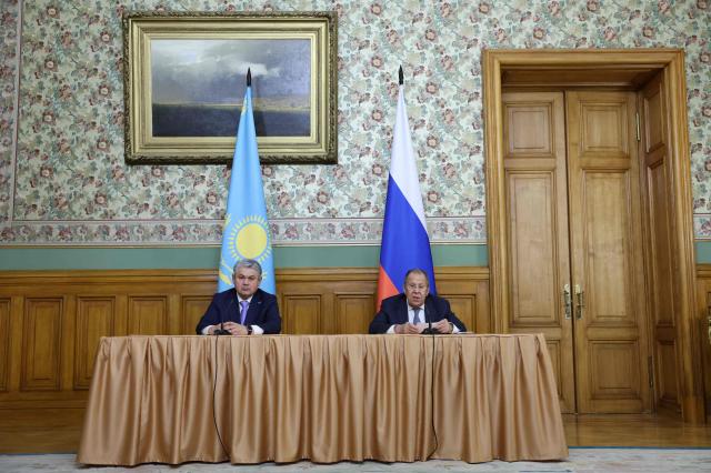Russian Foreign Minister Sergei Lavrov and his Kazakh counterpart Ermek Kosherbayev attend a press conference following their talks in Moscow on October 22, 2025. (Photo by Ramil Sitdikov / POOL / AFP)