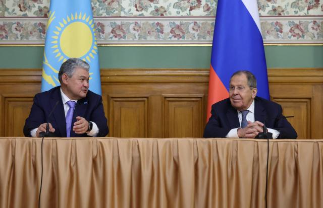 Russian Foreign Minister Sergei Lavrov and his Kazakh counterpart Ermek Kosherbayev attend a press conference following their talks in Moscow on October 22, 2025. (Photo by Ramil Sitdikov / POOL / AFP)