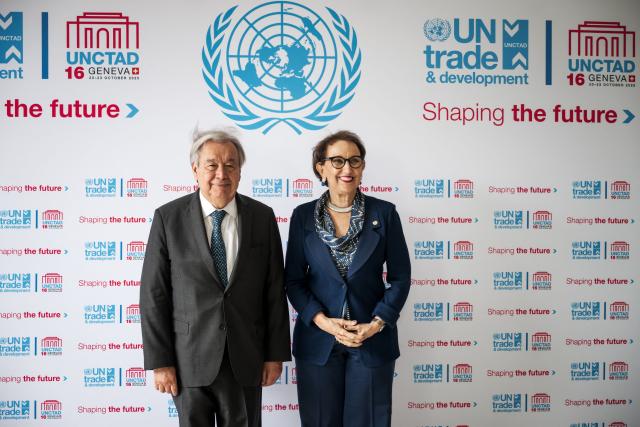 UN Secretary General Antonio Guterres (l) poses withUnited Nations Trade and Development (UNCTAD) Secretary-General Rebeca Grynspan (R) before addressing the audience during the 16th United Nations Trade and Development (UNCTAD) ministerial conference, in Geneva on October 22, 2025. (Photo by Fabrice COFFRINI / AFP)