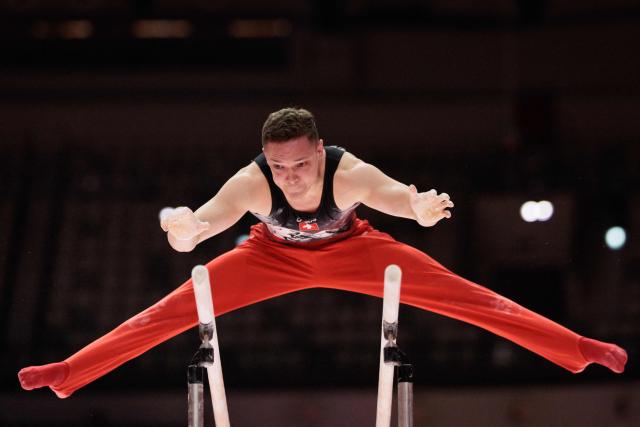 Switzerland’s Noe Seifert competes on the parallel bars during the men's all-around final at the 53rd FIG Artistic Gymnastics World Championships in Jakarta on October 22, 2025. (Photo by Yasuyoshi CHIBA / AFP)