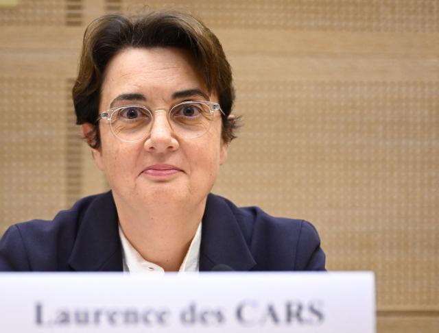 President of the Louvre Museum Laurence des Cars looks on prior to the start of a hearing before the Senate's culture committee at the French Senate in Paris on October 22, 2025. Laurence des Cars has not made any public statement since the theft on October 19, 2025. Des Cars, who became the first woman to run the Louvre in 2021, is expected to be questioned about security at the Apollo Gallery, which houses the royal collection of gems. The museum on October 21, 2025 hit back at criticism that the display cases protecting the stolen jewellery were fragile, saying they were installed in 2019 and "represented a considerable improvement in terms of security". (Photo by Bertrand GUAY / AFP) / ALTERNATE CROP