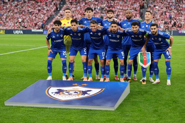 Qarabagh's palyers pose for a team photo before the UEFA Champions League league phase day 3 football match between Athletic Club Bilbao and Qarabagh at San Mames Stadium in Bilbao on October 22, 2025. (Photo by Cesar MANSO / AFP)