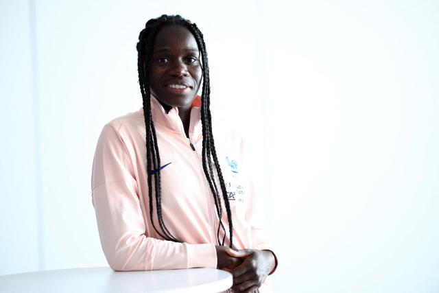 (FILES) France's defender #19 Griedge Mbock Bathy poses during an interview in Clairefontaine-en-Yvelines, Paris' suburb, on June 18, 2025. France's national women team's captain Griedge Mbock, 30, began a psychology degree in September alongside her season at PSG so she could become a sports psychologist at the end of her career, she told AFP in an interview on October 22, 2025. (Photo by Anne-Christine POUJOULAT / AFP)