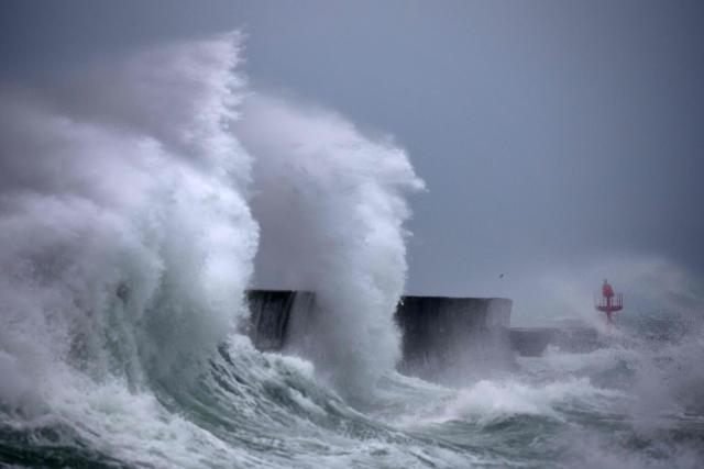 Waves hit the port of Plobannalec-Lesconil, western France October 22, 2024 as strong winds hit the coast at the passage of the storm Benjamin. (Photo by Fred TANNEAU / AFP)