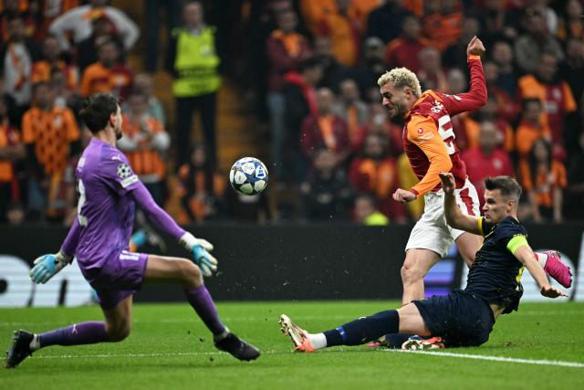 Bodo/Glimt's Norwegian defender #04 Odin Bjortuft (R) tackles the ball as Galatasaray's Turkish forward #53 Baris Alper Yilmaz attempts to score during the UEFA Champions League, league phase - day 3, football match between Galatasaray SK and Bodo/Glimt at the Rams Park in Istanbul on October 22, 2025. (Photo by Ozan KOSE / AFP)