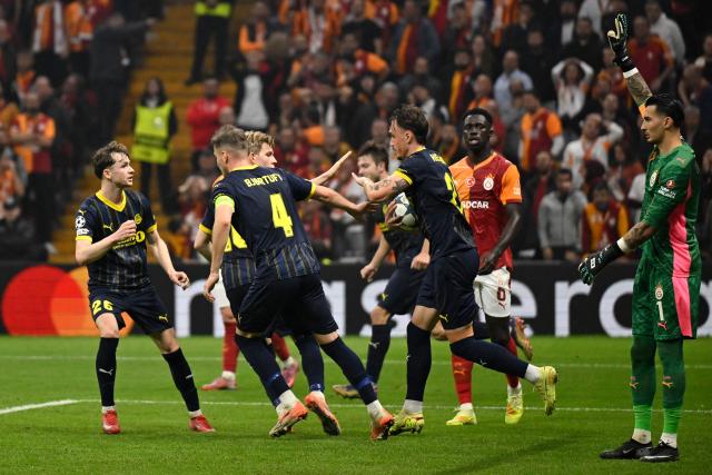 Bodo/Glimt's Norwegian forward #21 Andreas Helmersen (C) celebrates with teammates after scoring his team's first goal during the UEFA Champions League, league phase - day 3, football match between Galatasaray SK and Bodo/Glimt at the Rams Park in Istanbul on October 22, 2025. (Photo by YASIN AKGUL / AFP)