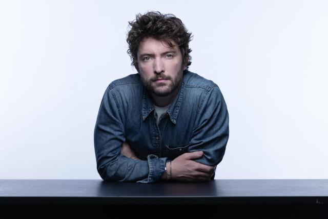 French journalist and writer Paul Gasnier poses during a photo session in Paris on October 22, 2025. (Photo by JOEL SAGET / AFP)